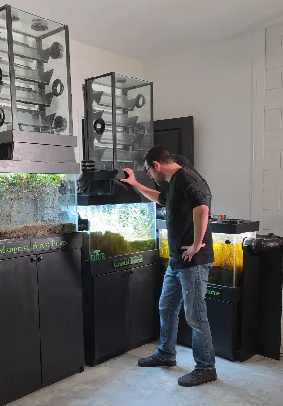 Creator observing the live data and ecosystems inside the miniBIOTA biomes